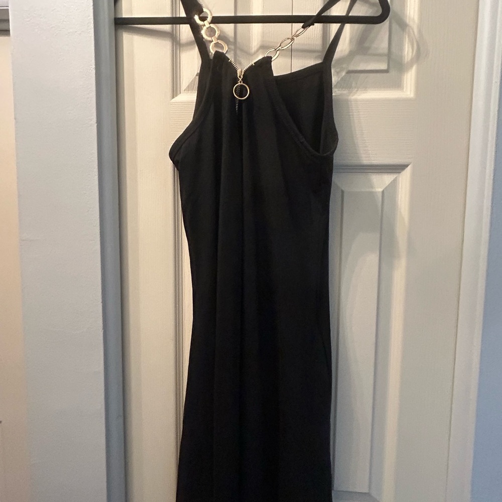 Elegant Black Dress with Gold Chain Detail